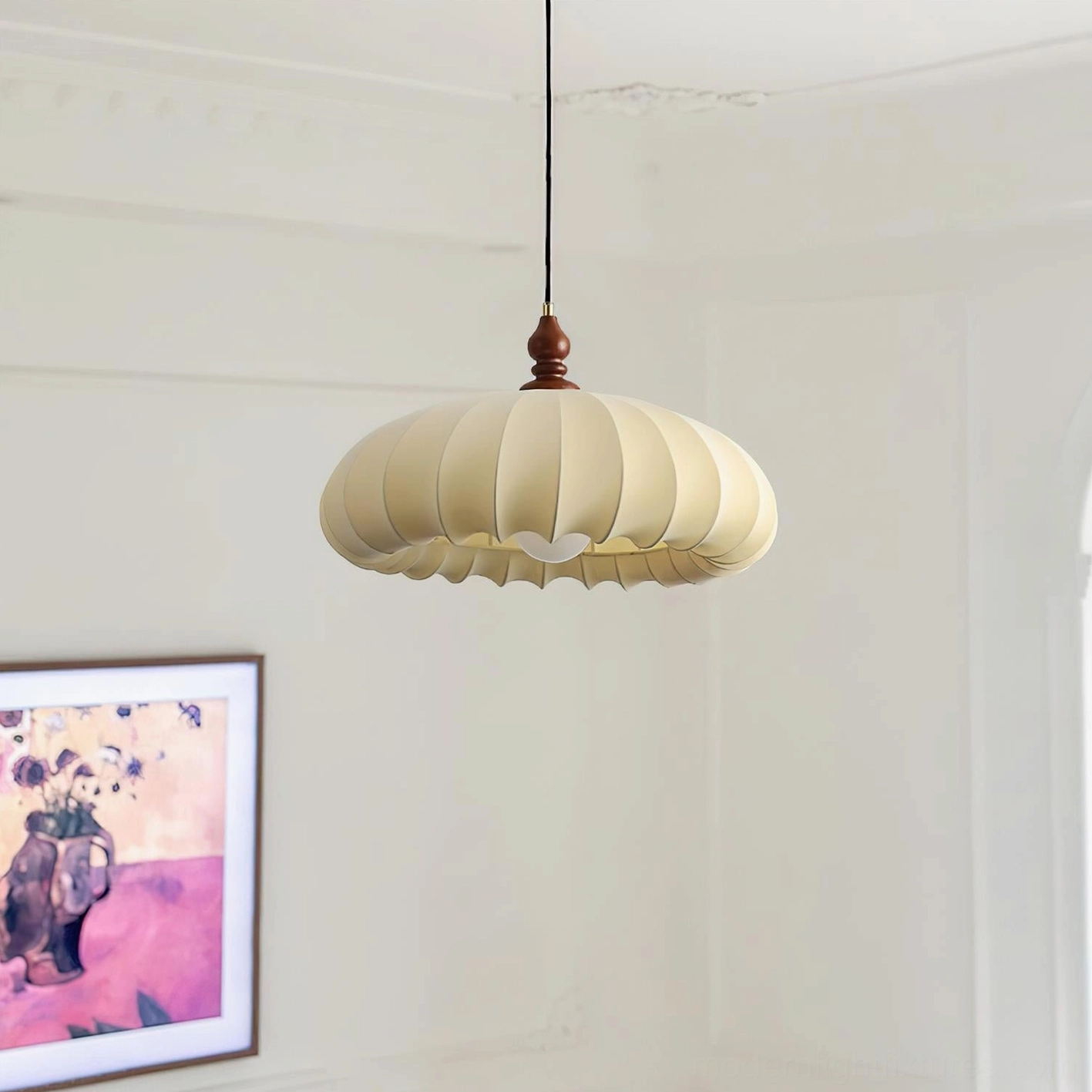 Lotus Belly pendant lamp installed in minimalist white residential room, side view showing ribbed fabric shade and wooden ceiling mount, soft warm glow