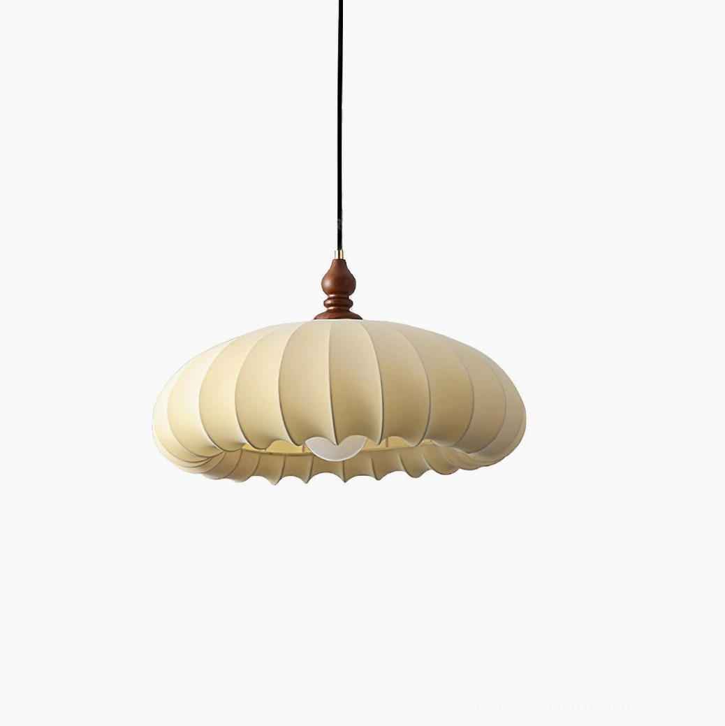 Lotus Belly pendant light with cream pleated fabric shade and dark walnut wood connector, front studio view in Walnut Color and White finish