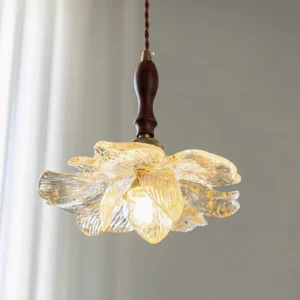 Illuminated lotus pendant light hanging indoors with warm glow and sheer curtain backdrop