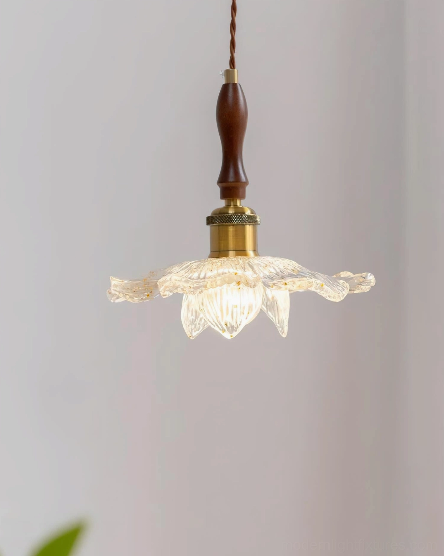 Resin lotus pendant lamp with gold leaf accents and botanical glass shade design