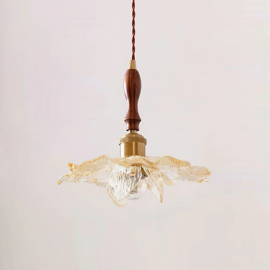 Lotus pendant light with rippled glass shade and walnut wood brass fixture on warm background