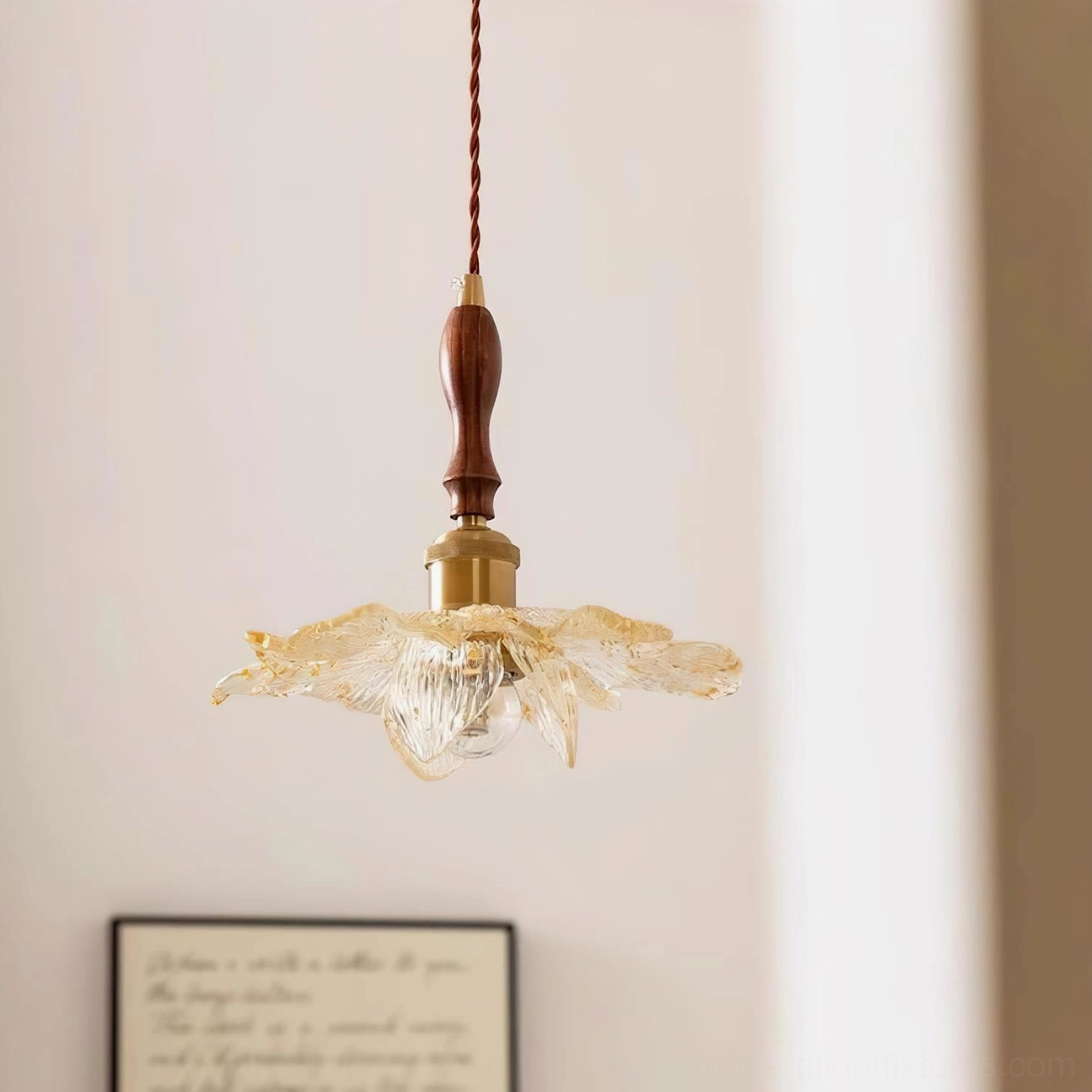 Lotus flower pendant lamp eye-level view with framed wall art and warm ambient lighting
