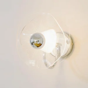 Illuminated three-color changing LED lotus wall sconce showing glowing mesh shade with chrome base