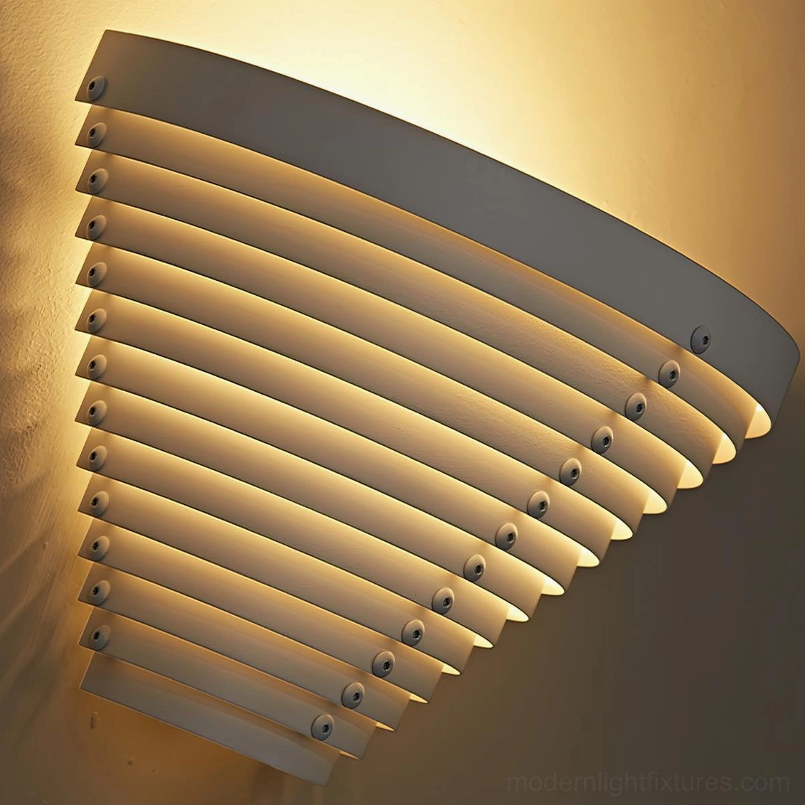 Close-up detail of geometric louvered wall lamp showing internal metal slats, gaps, and mounting structure