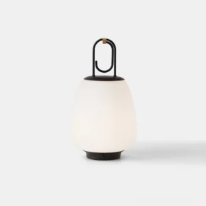 Lucca portable table lamp front view with frosted white glass shade and black metal frame on studio background
