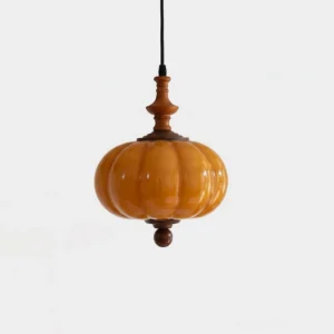Lucerna amber ribbed glass pendant light with walnut wood hardware, front studio view