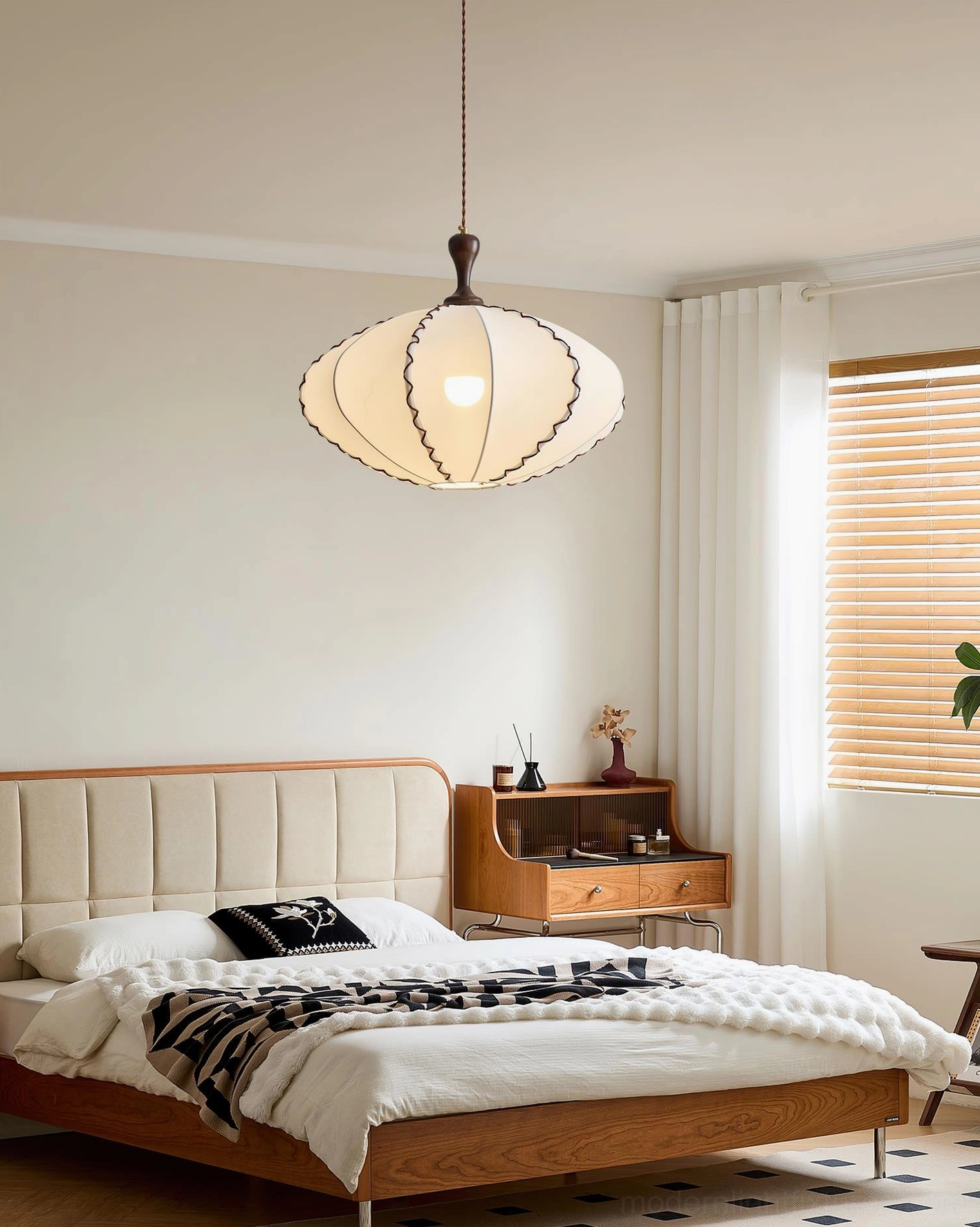 Lucian vintage textile pendant light installed above mid-century modern wooden bed in bedroom interior design