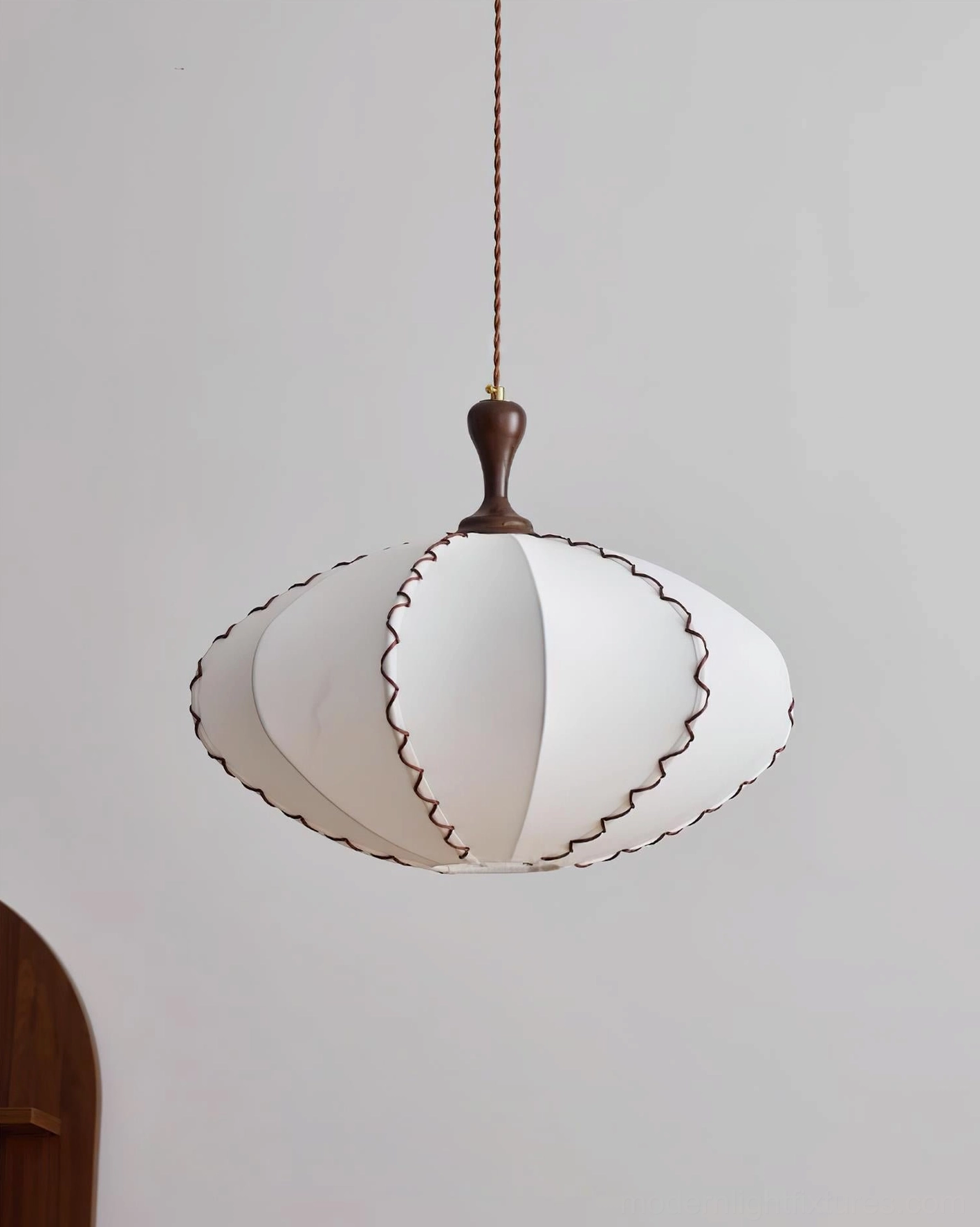 Lucian pendant light demonstrating soft warm glow and fabric diffusion properties in interior lighting application
