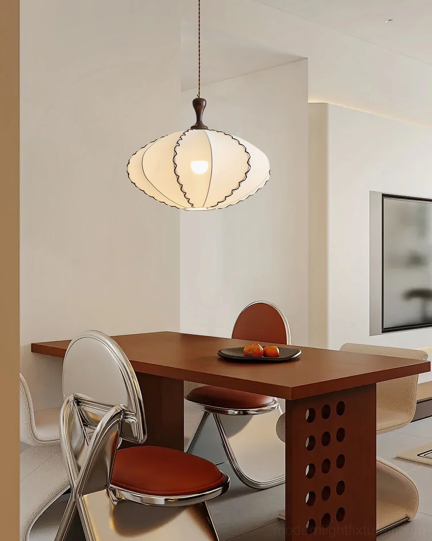 Lucian scalloped fabric pendant light with warm glow above wooden dining table in modern dining space