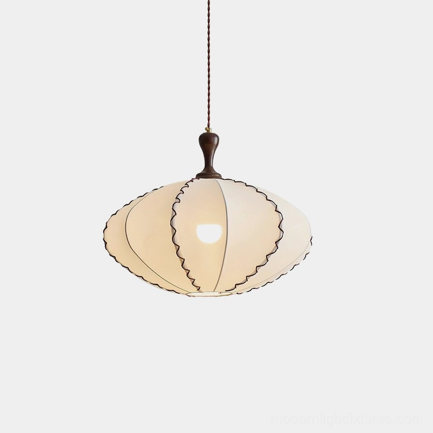 Lucian scalloped fabric pendant light with cream-colored shade and walnut finial, front view in minimalist white studio setting