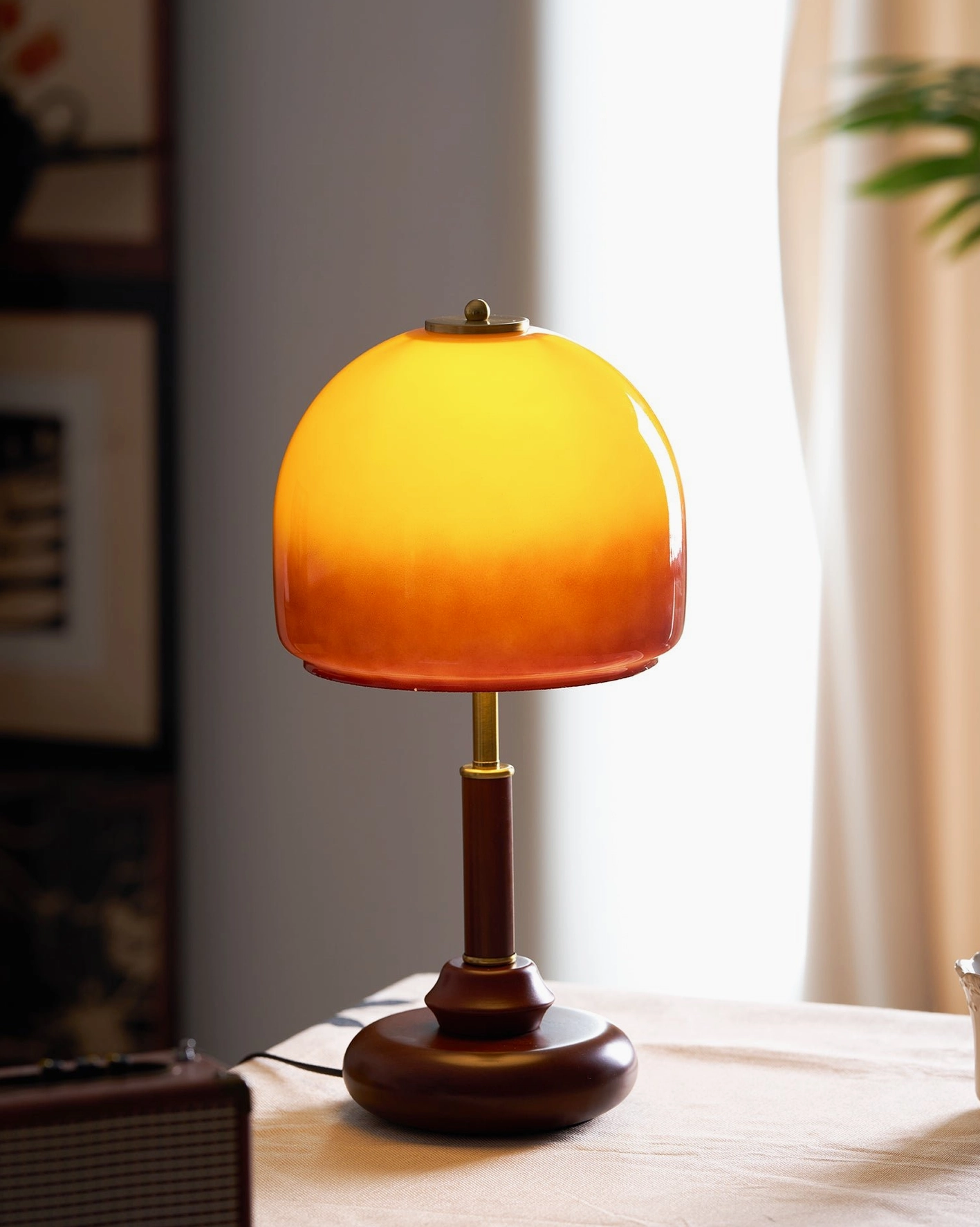 Luciano amber table lamp in scandinavian minimalist interior with natural wood furniture and neutral palette