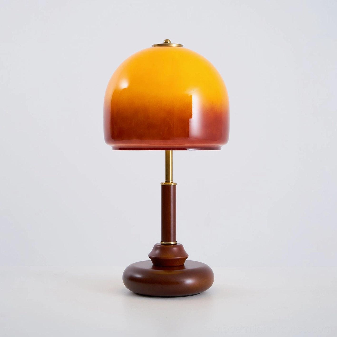 Luciano dome table lamp with warm amber glow creating ambiance in modern living space, functional lighting