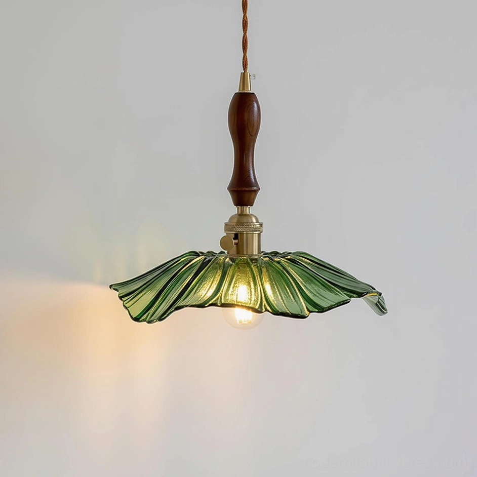 Green hand-blown glass pendant light with fluted lotus design, studio product photography