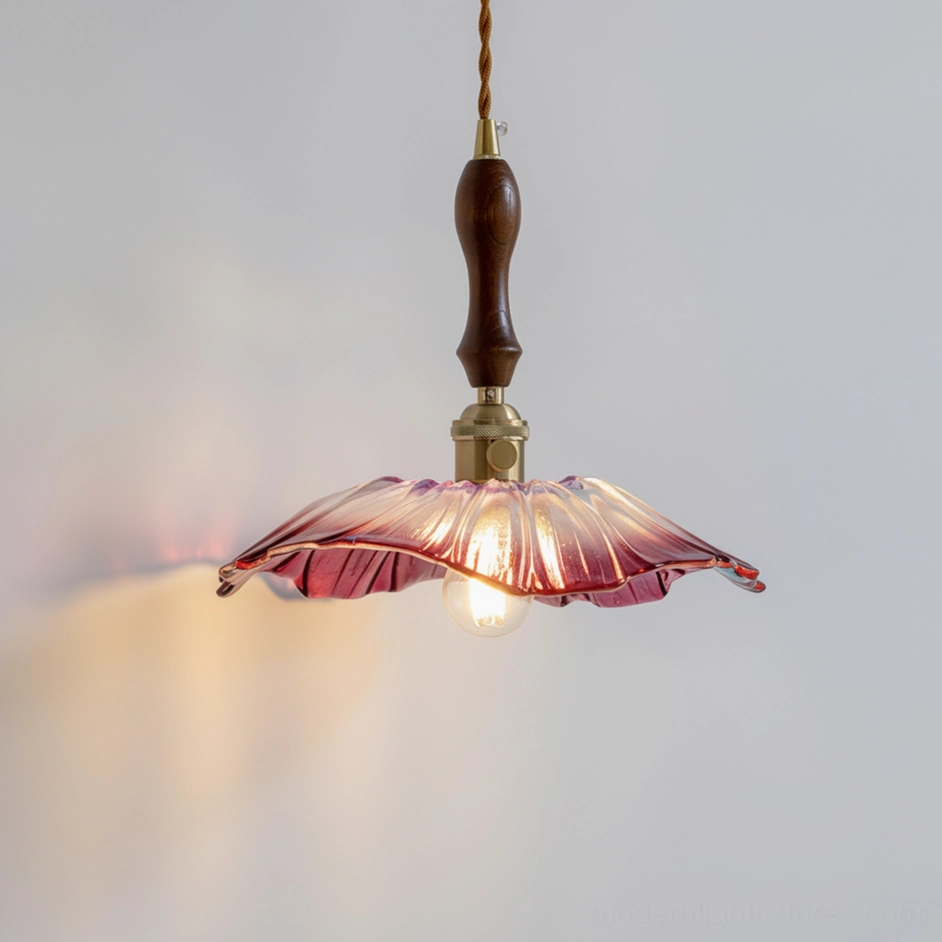 Wine-red lotus glass pendant light with brass and wood hardware, low-angle interior wall view