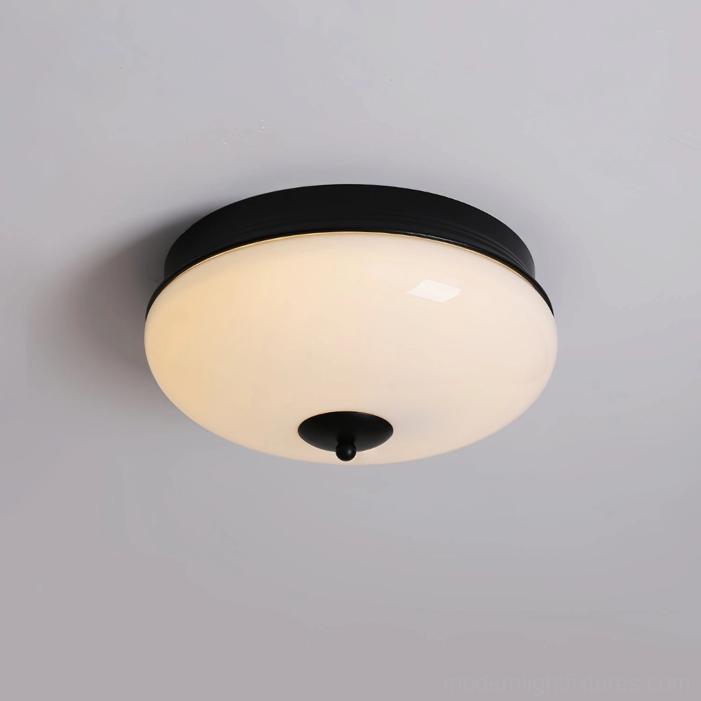 Ludo matte black ceiling light fixture overhead view with unlit white frosted dome and finial