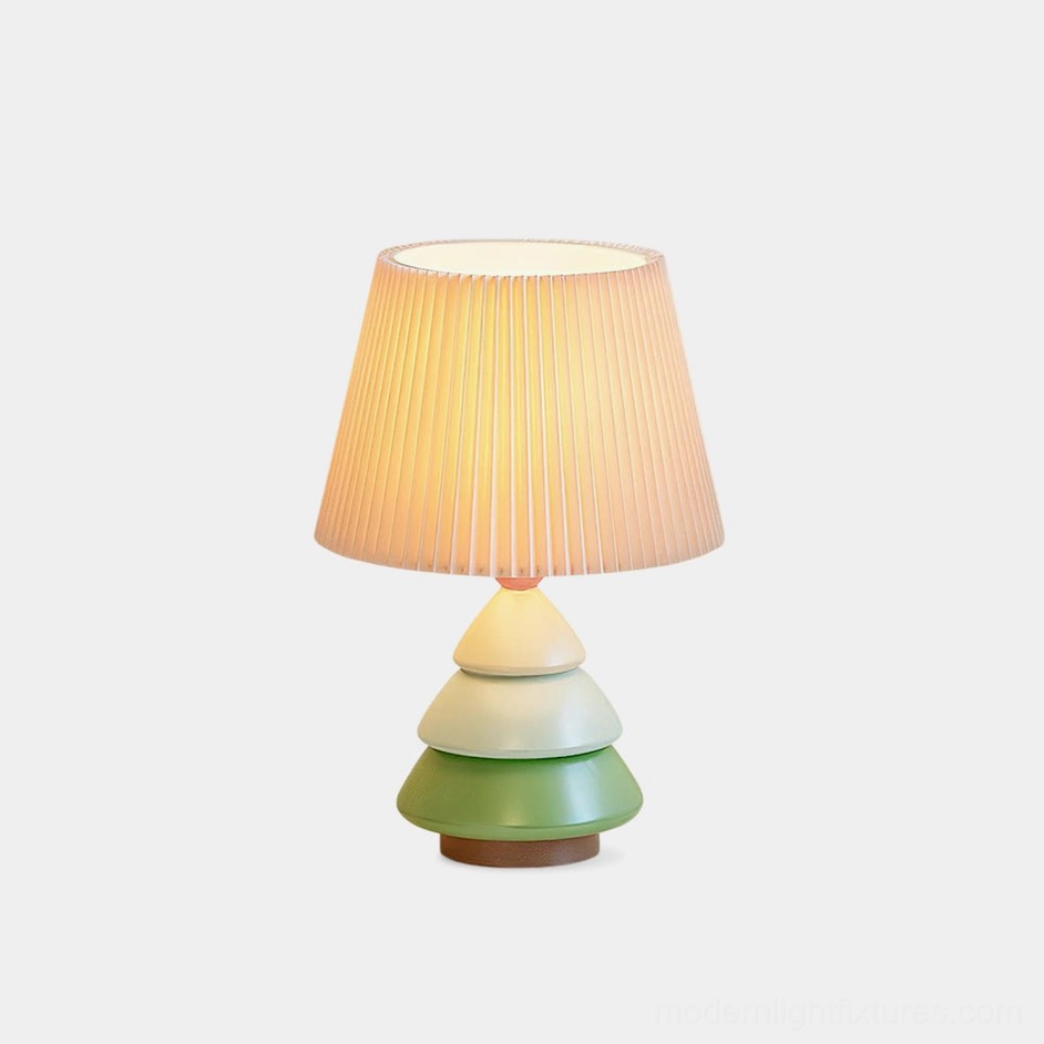 Luma Globe modern table lamp front view with pleated shade and gradient green to ivory tiered resin base on white background