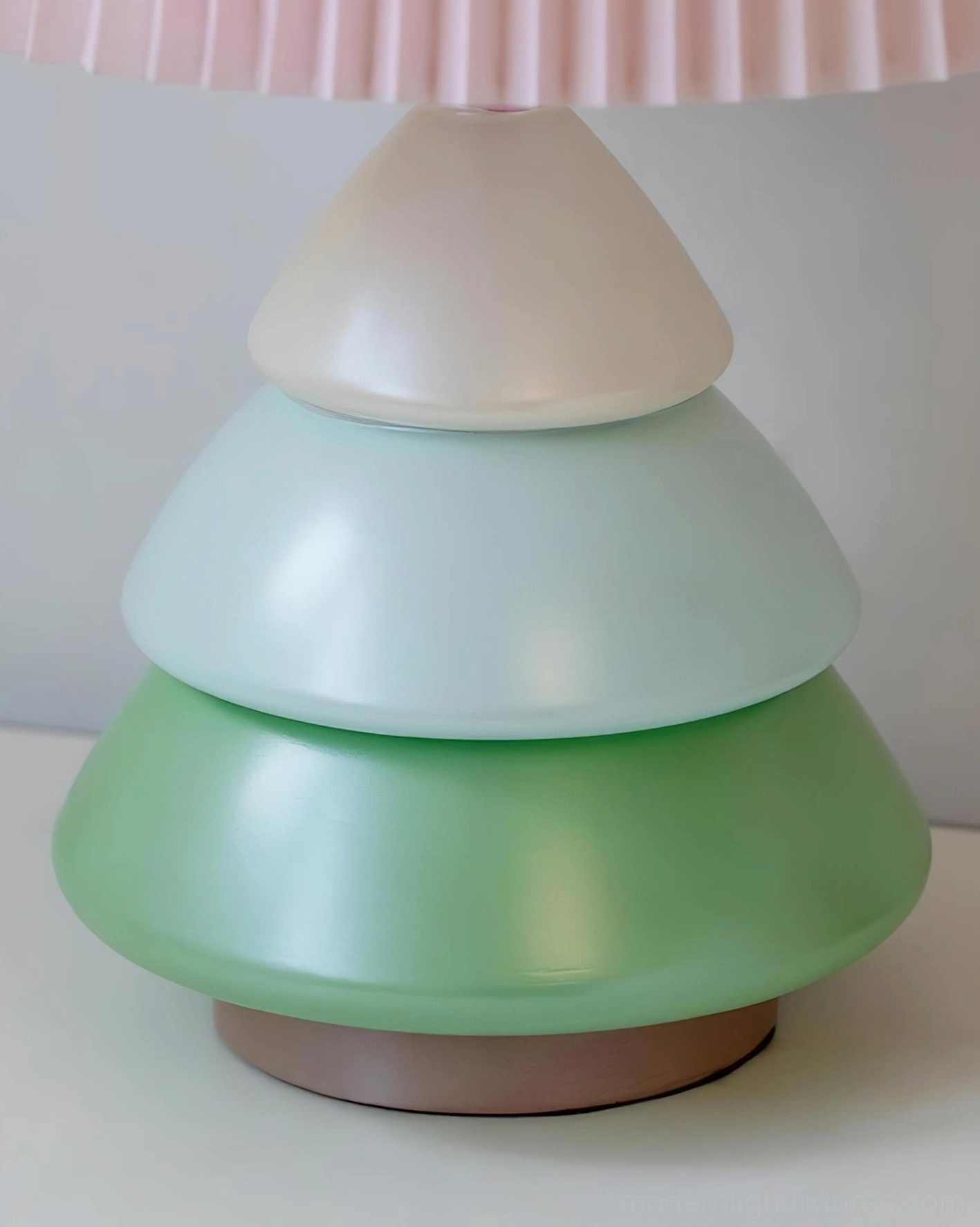 Luma Globe resin base close-up detail displaying tiered structure gradient pastel green to ivory color finish