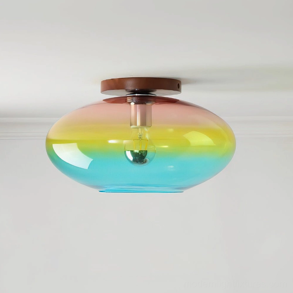Lumia ceiling light front studio view showing gradient glass shade with visible metal bulb hardware and smooth ombre finish