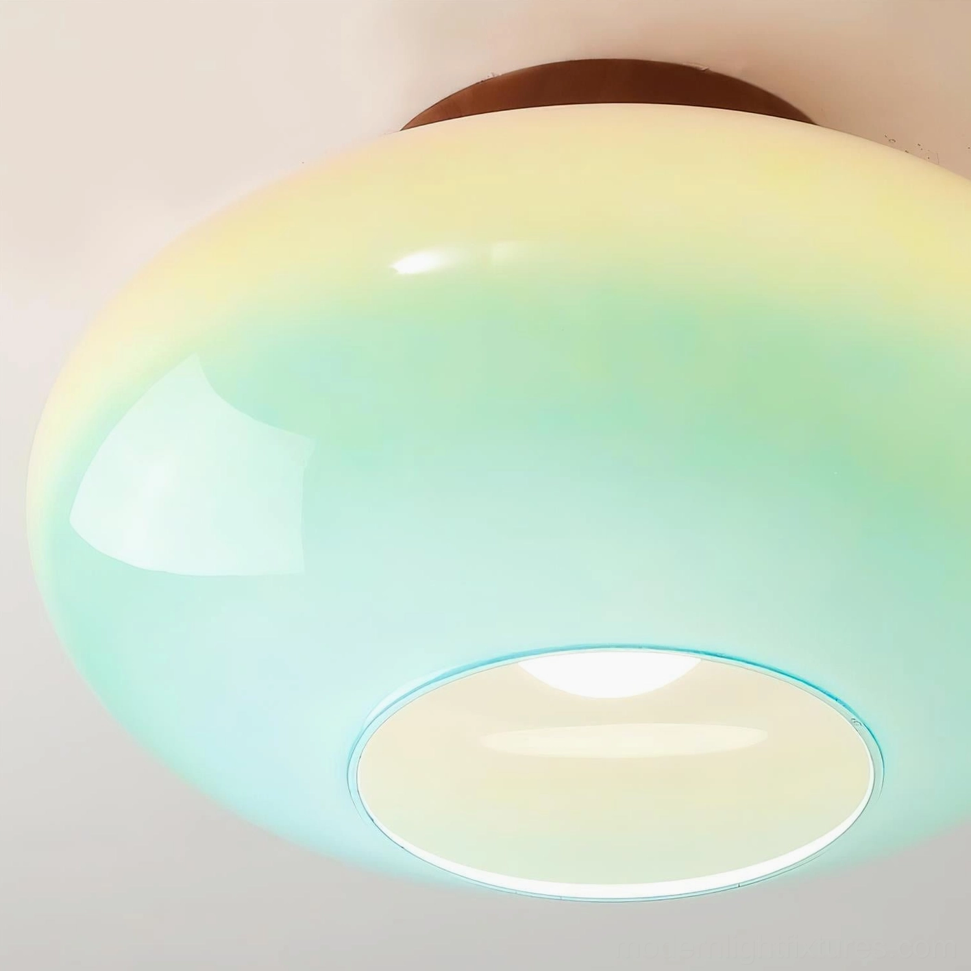 Lumia ceiling light fixture gradient glass shade close-up showing seamless ombré color transition and premium glass craftsmanship