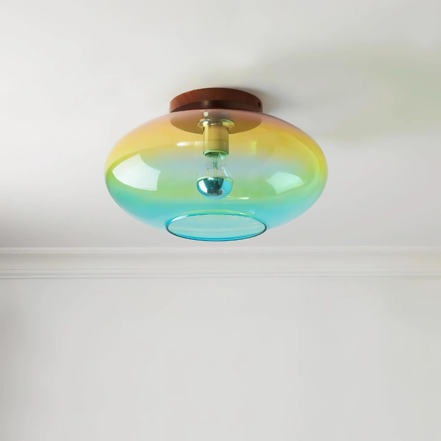 Lumia ombré ceiling light bottom-facing view displaying exposed bulb assembly and gradient glass shade chromatic transition