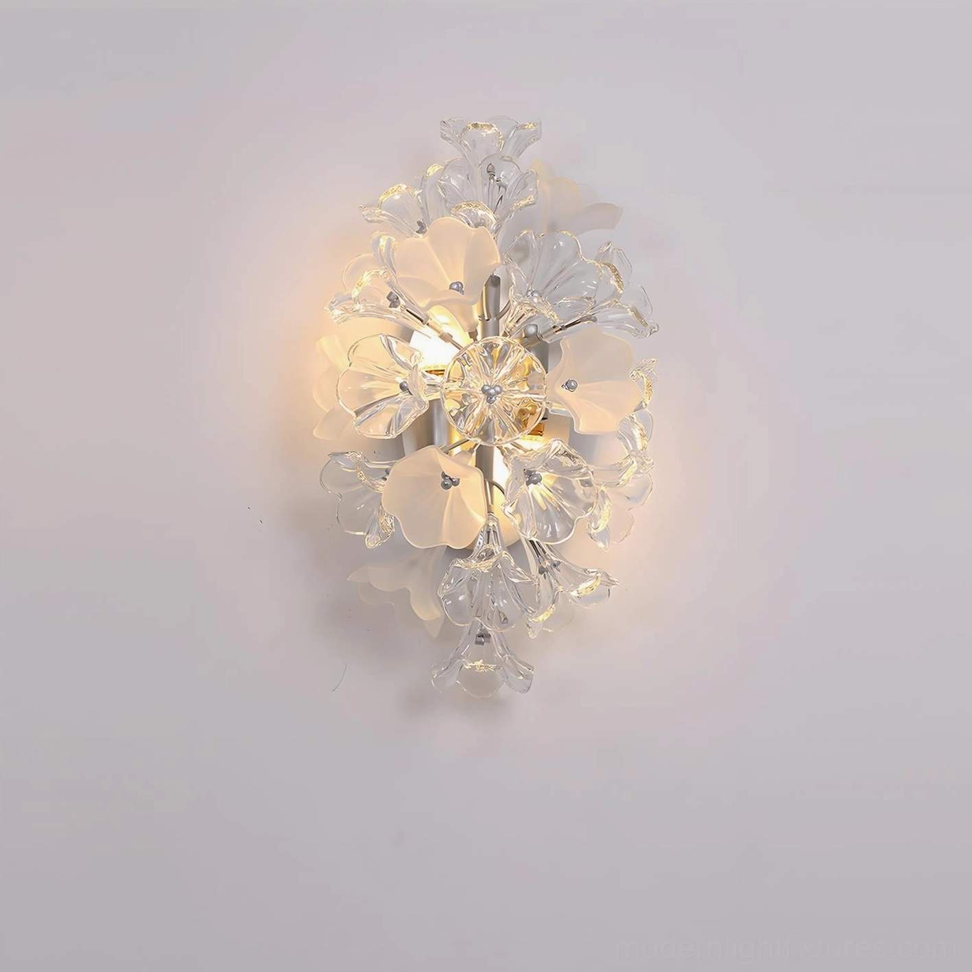 Illuminated Lumiflora flower wall sconce showing glowing light through translucent glass petals