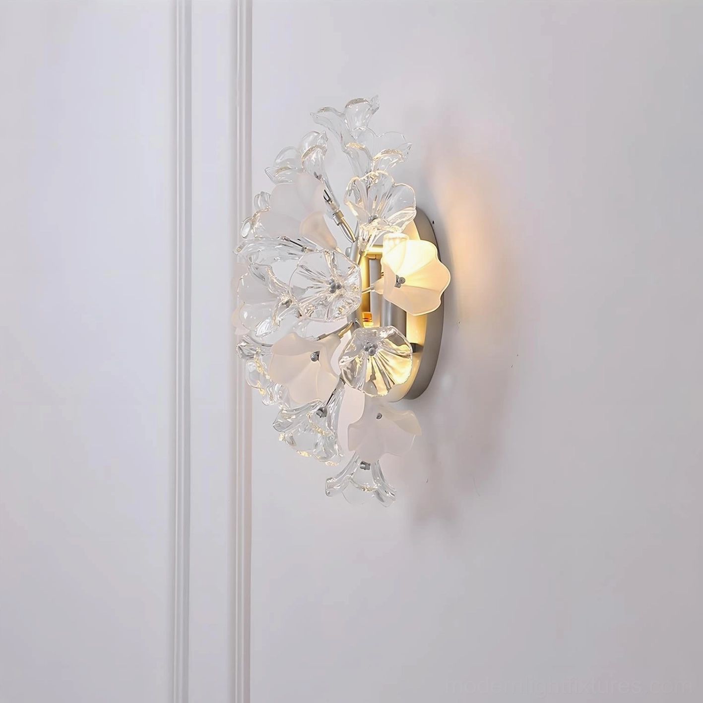 Side view of Lumiflora wall sconce with curved metal backplate and frosted glass flower petals