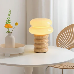 Wooden stacked table lamp three-quarter angle view showing ash wood rings and frosted glass shade