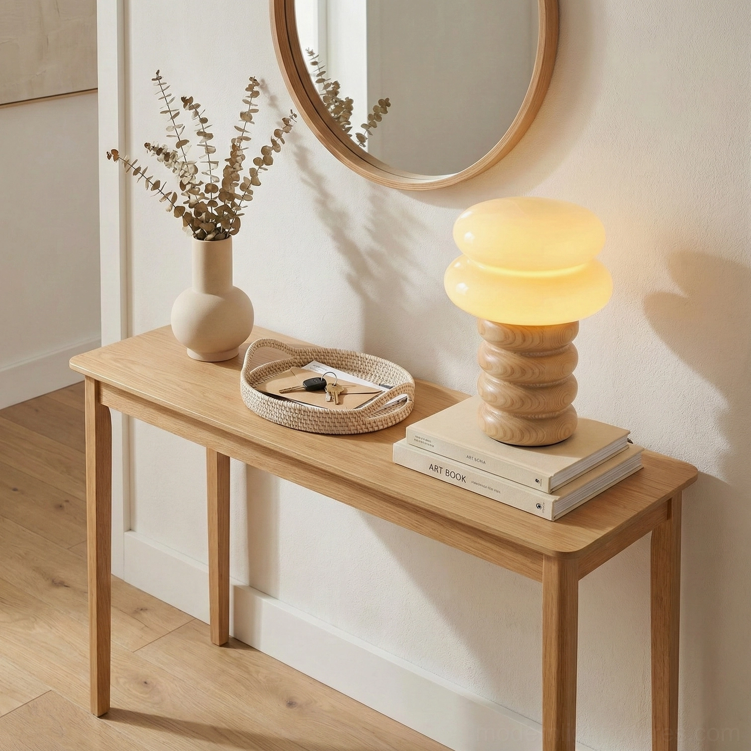 Japandi style table lamp on entryway console with dried flower decor and natural wood furniture