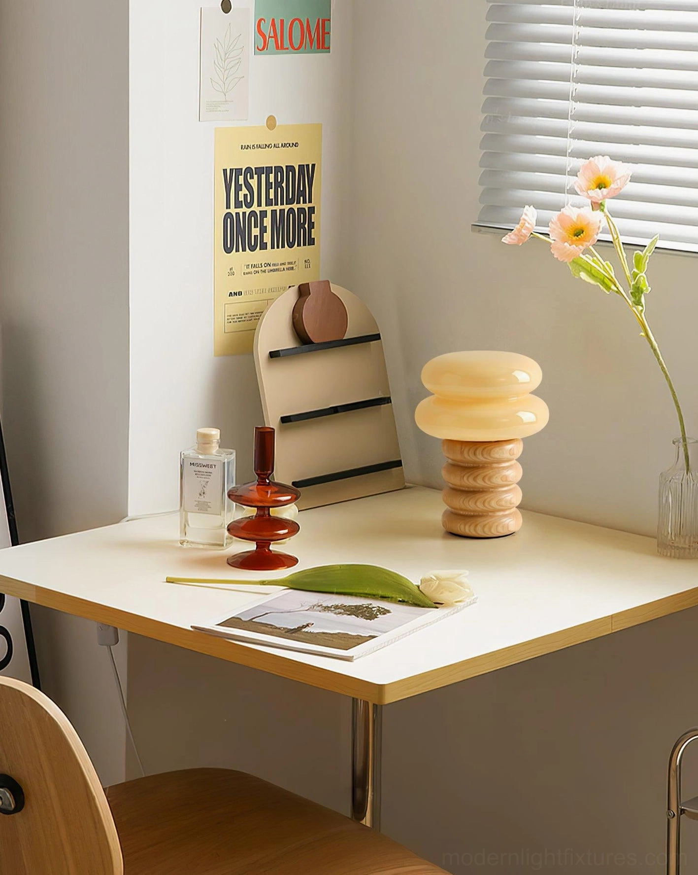 Contemporary table lamp with layered wooden rings and frosted glass shade detail