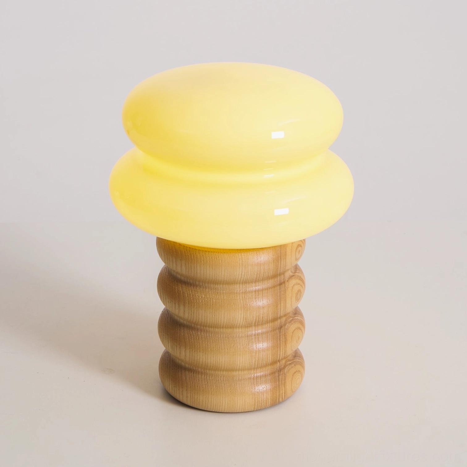 Contemporary wooden table lamp stacked rings design showcasing natural grain variations