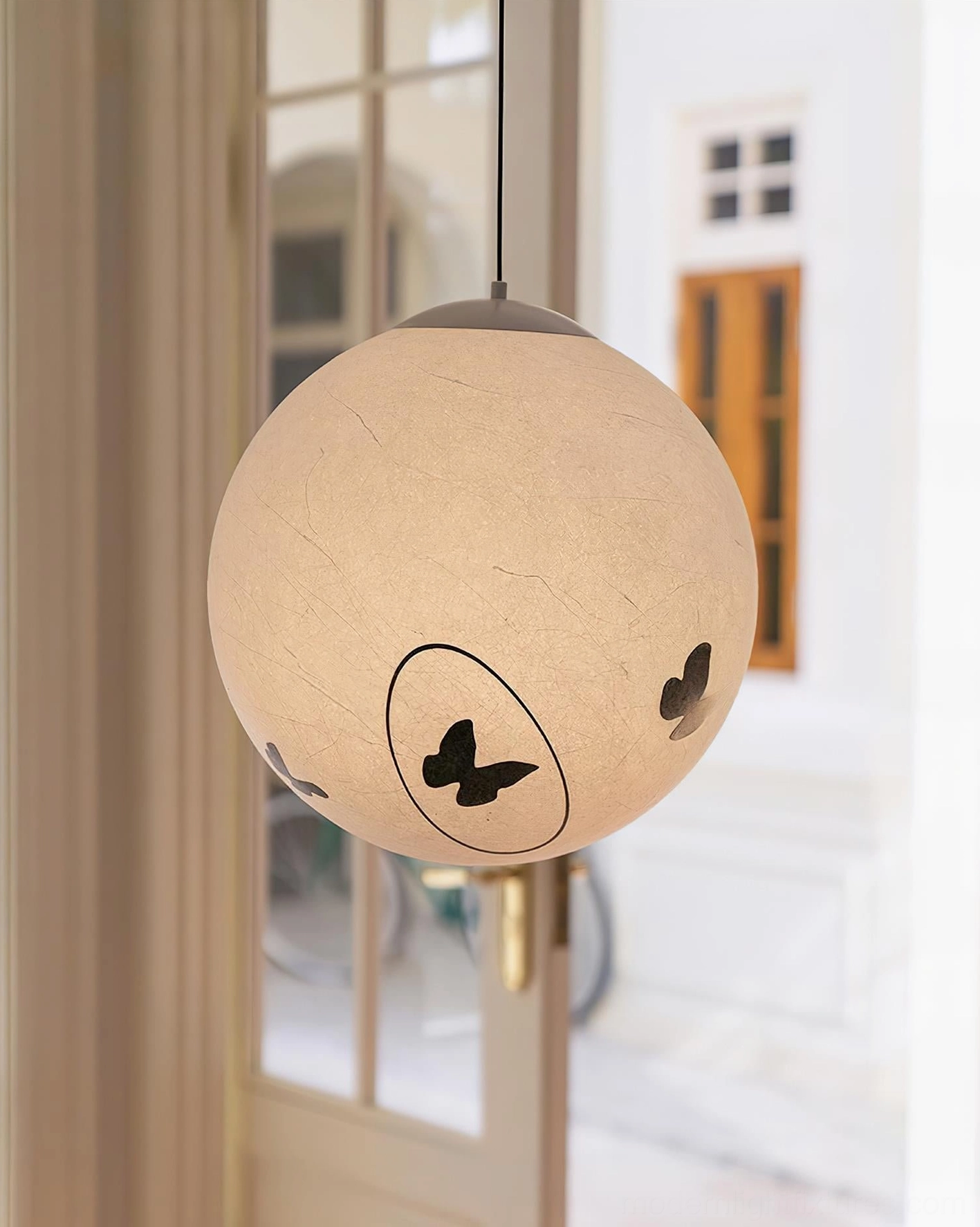Luna Flutter pendant lamp in modern bedroom setting, warm beige shade with butterfly decals creating ambient light
