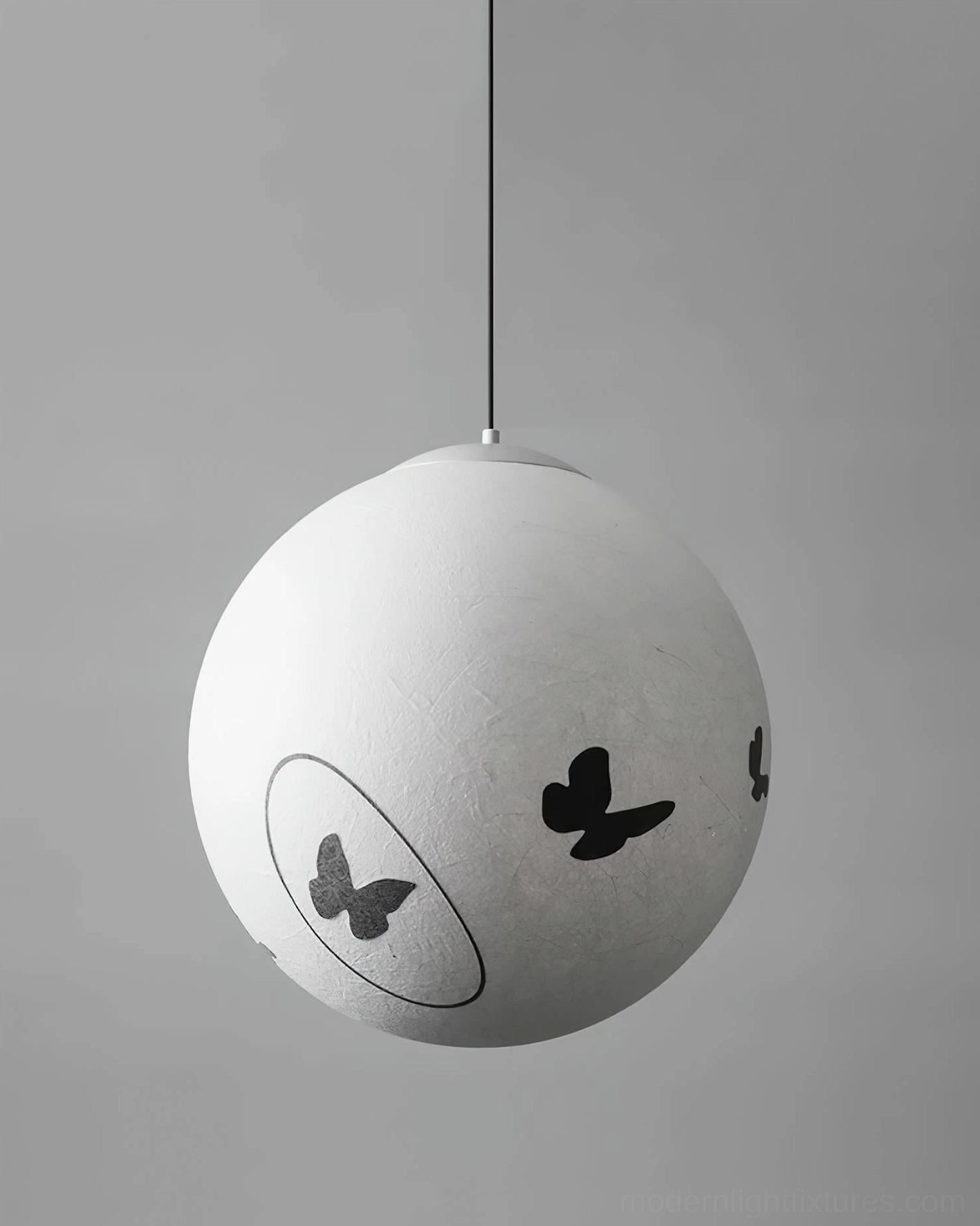 Luna Flutter modern butterfly pendant lamp exterior installation, glass door entryway with warm beige glow