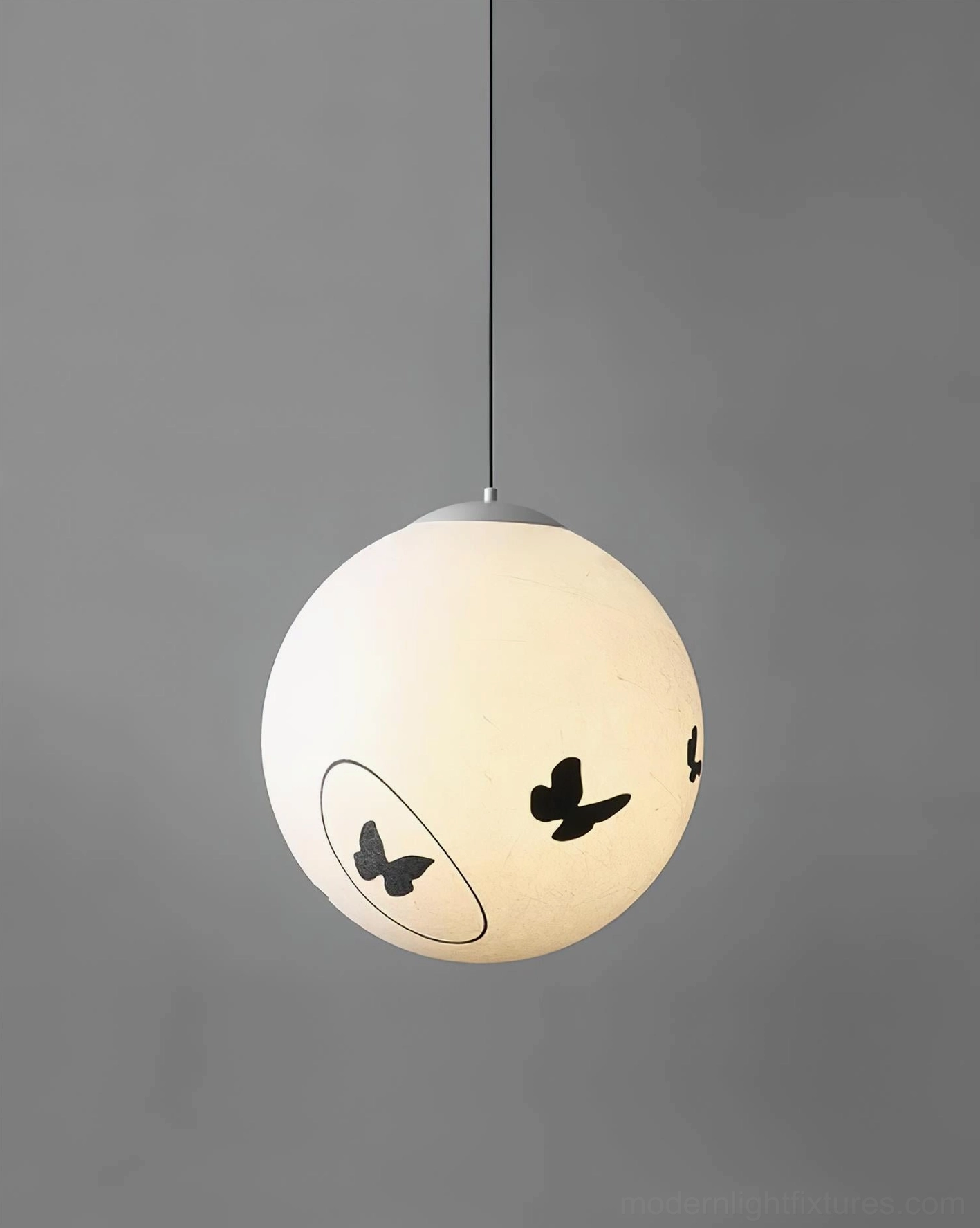 Luna Flutter butterfly pendant lamp in living room with modern furniture, contemporary pendant light fixture design