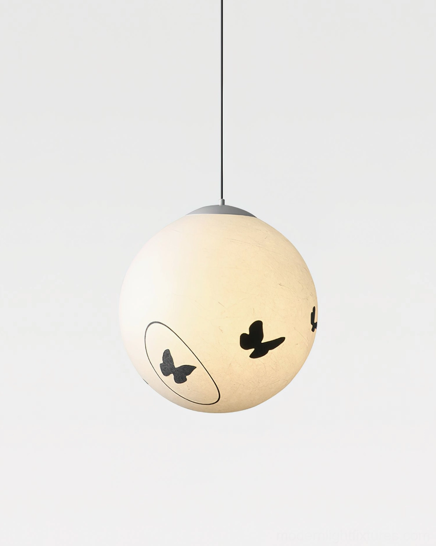 Luna Flutter pendant lamp detailed product photography, spherical design with butterfly silhouettes, studio lighting