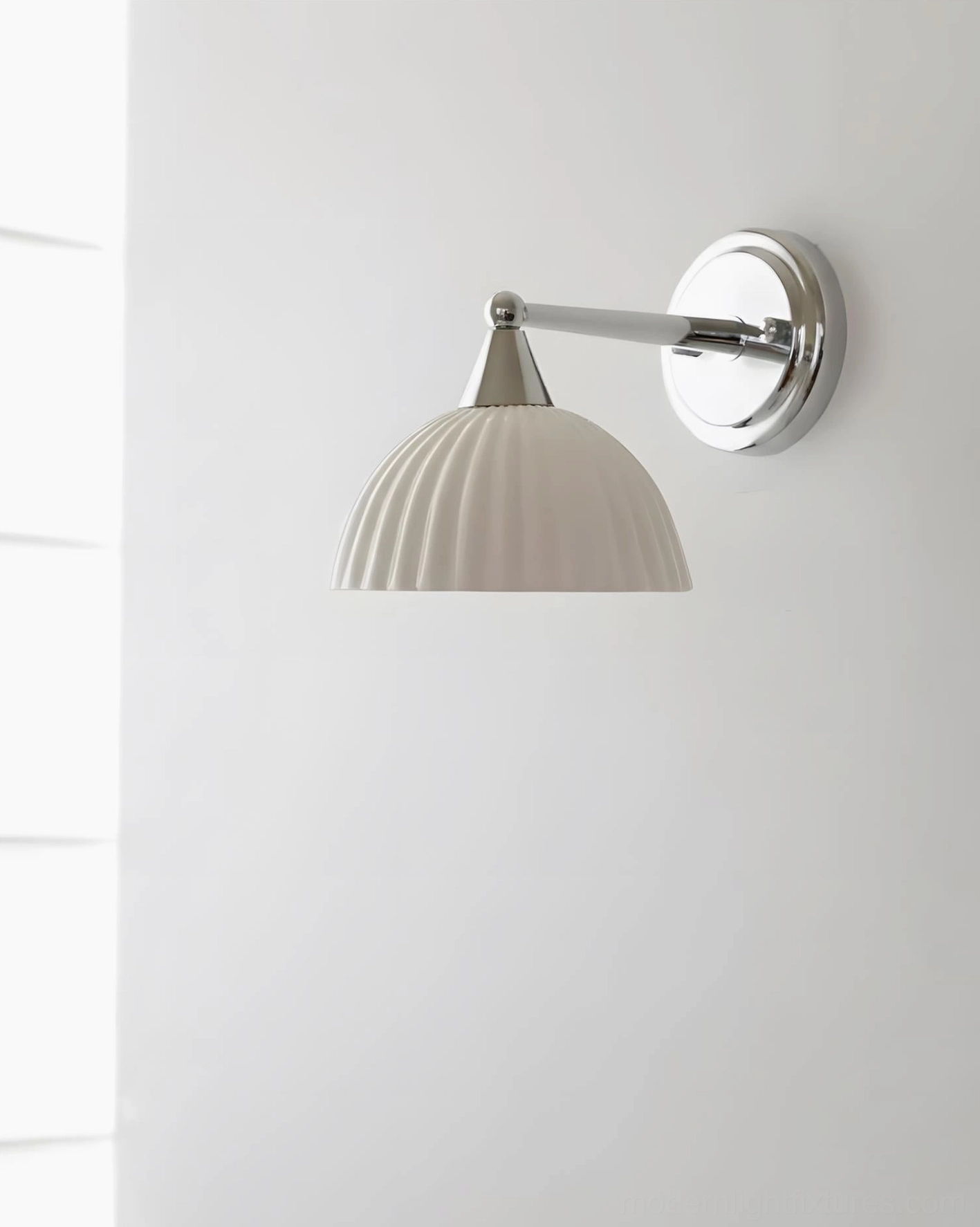 Luna Scallop pleated ceramic wall sconce front-facing studio view with polished chrome wall plate