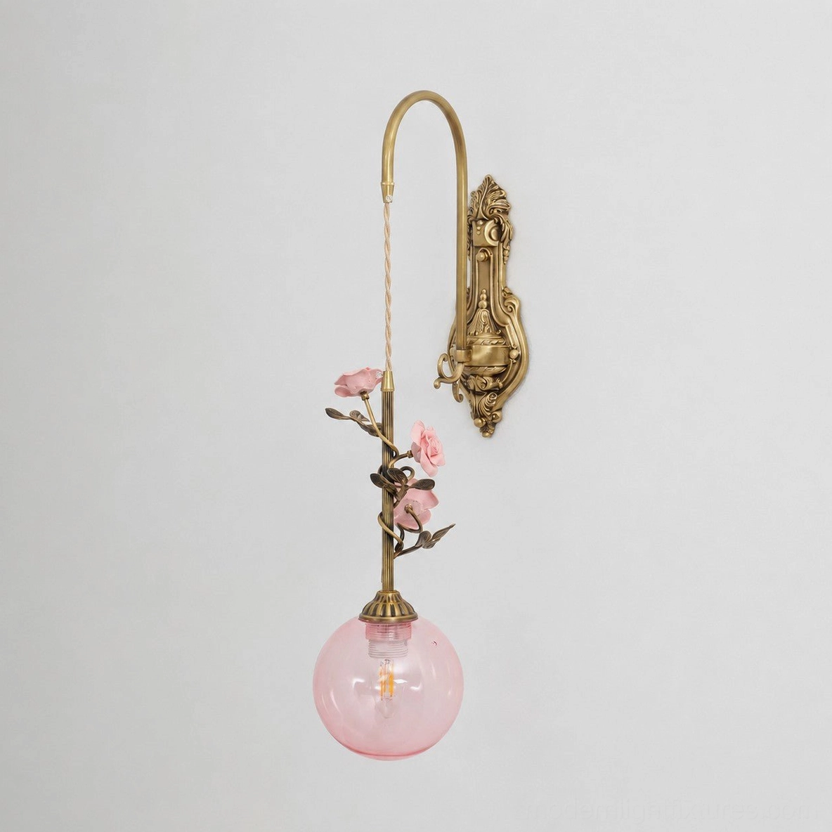Lunafleur porcelain rose wall sconce installed beside mirror in spa-like bathroom ambiance