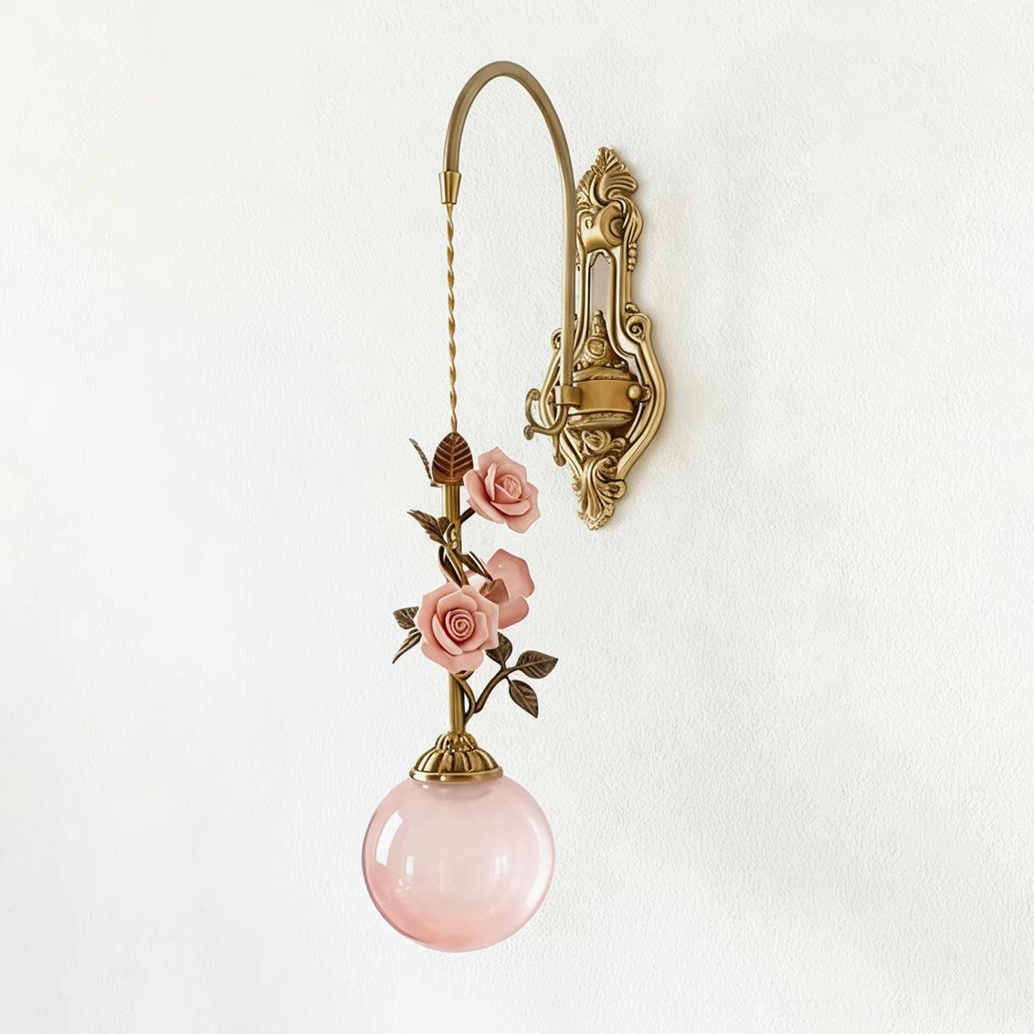 Lunafleur wall sconce close-up of brass body and pink frosted glass diffuser construction