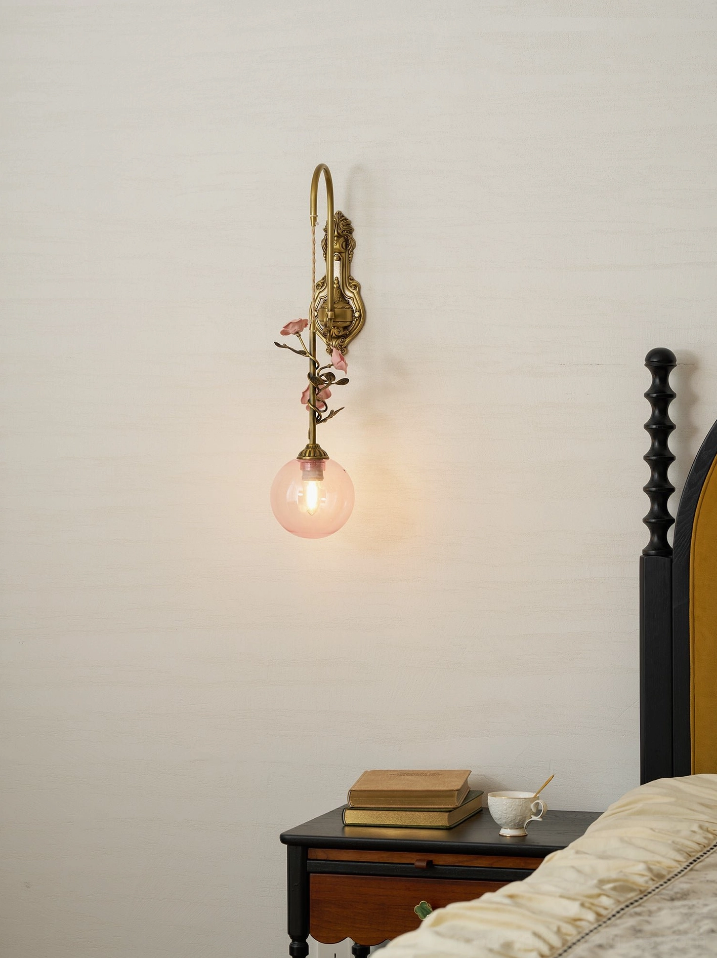 Lunafleur wall sconce with porcelain details in cottage style bathroom with vintage fixtures