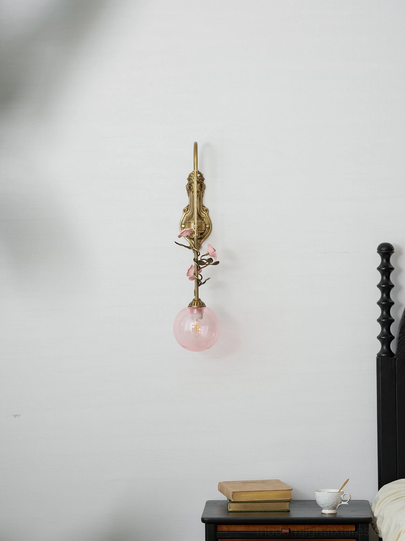Lunafleur brass wall sconce installed in eclectic bedroom design with mixed vintage decor