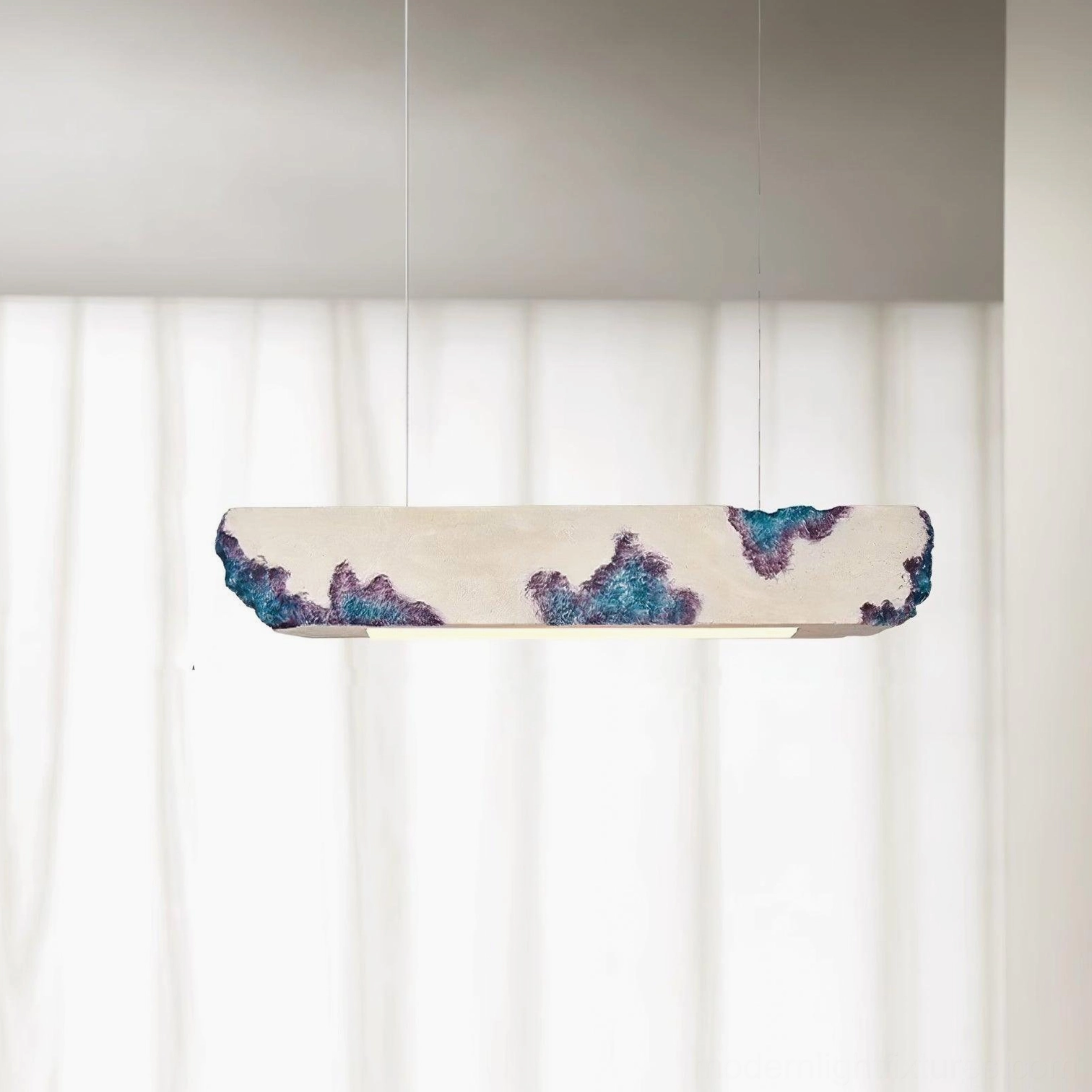 Lunar Gleam pendant light in modern living space - elongated linear fixture above seating area