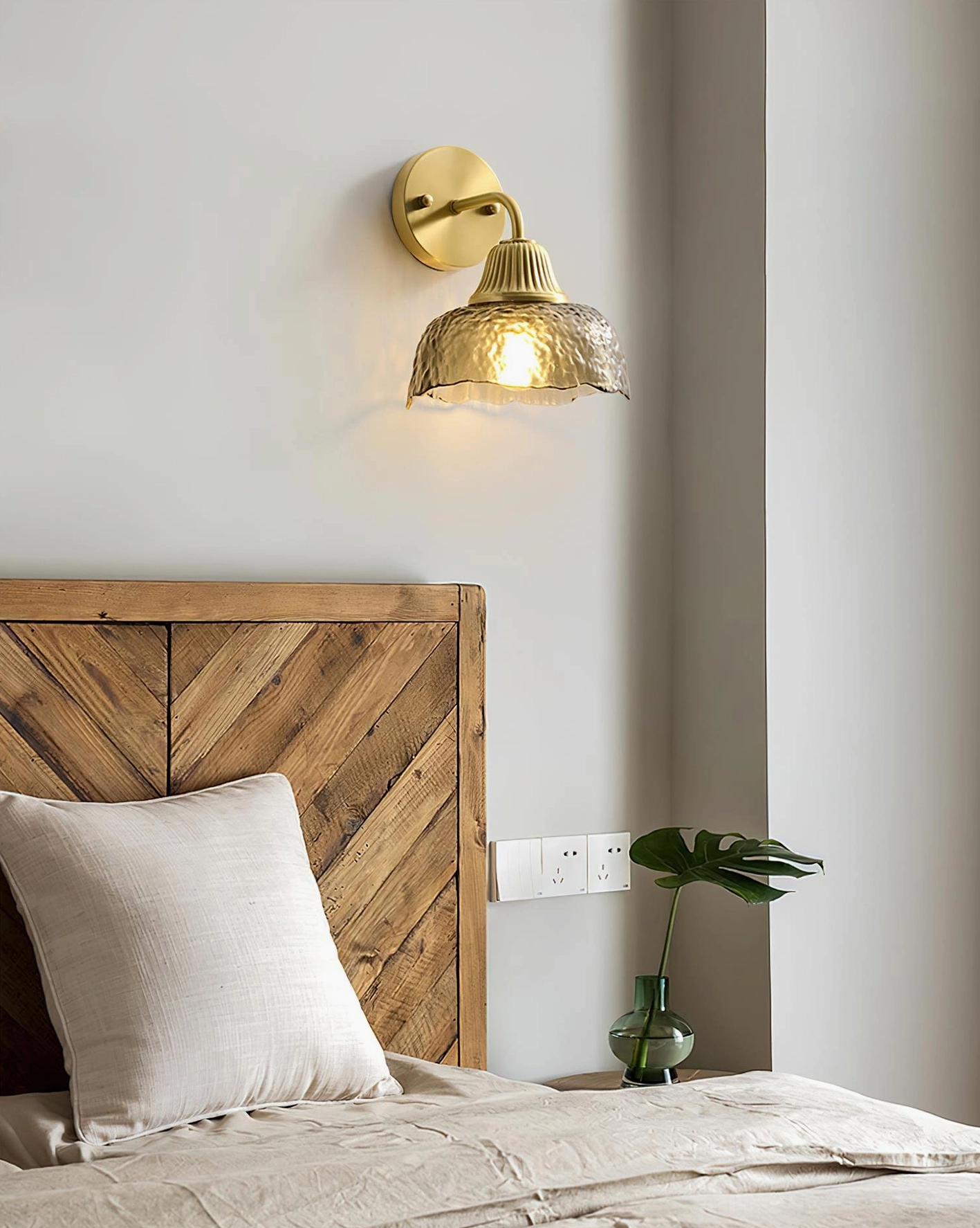 Lunara wall sconce bedroom lighting installation, bedside ambiance with chevron wooden headboard