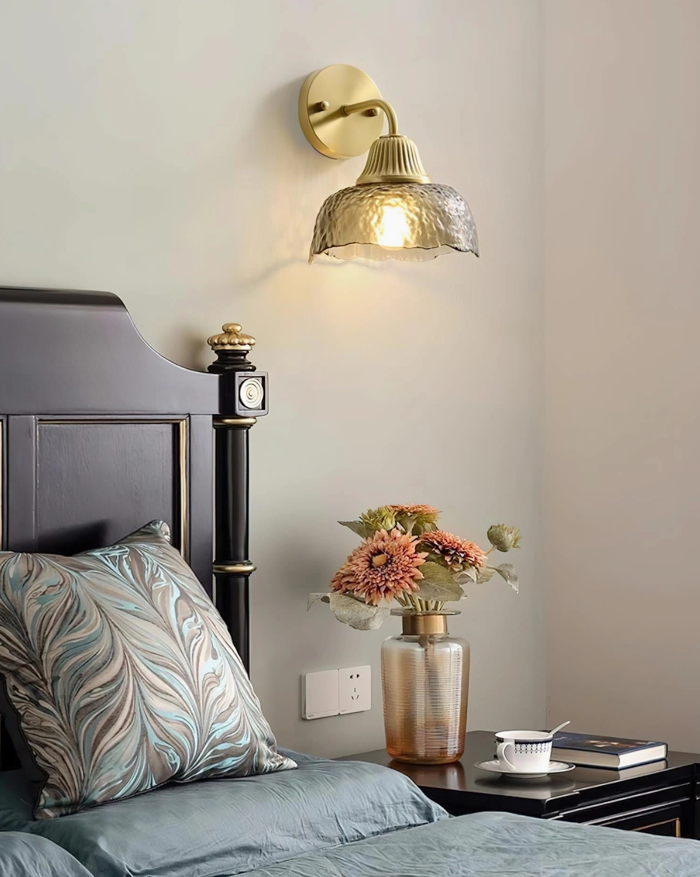 Lunara wall sconce classic bedroom bedside floral arrangement dark wood headboard interior design