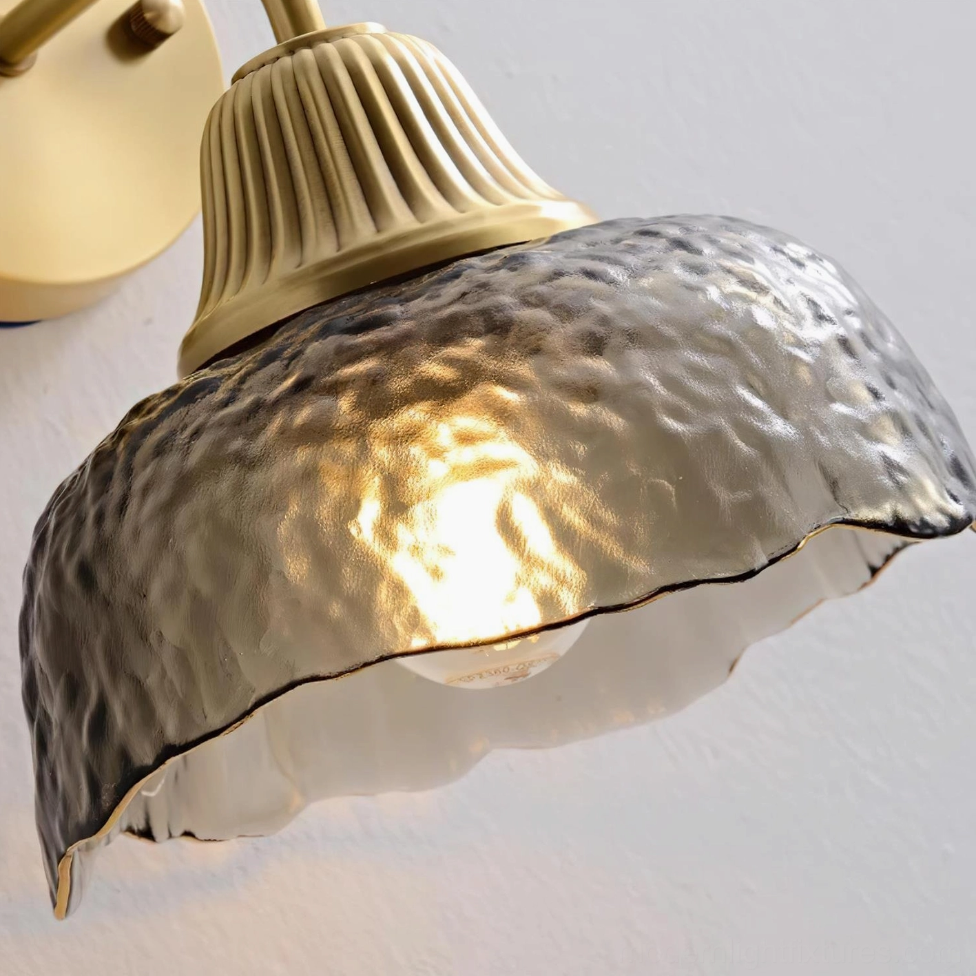 Lunara antique brass wall sconce sculptural form contemporary living room accent lighting