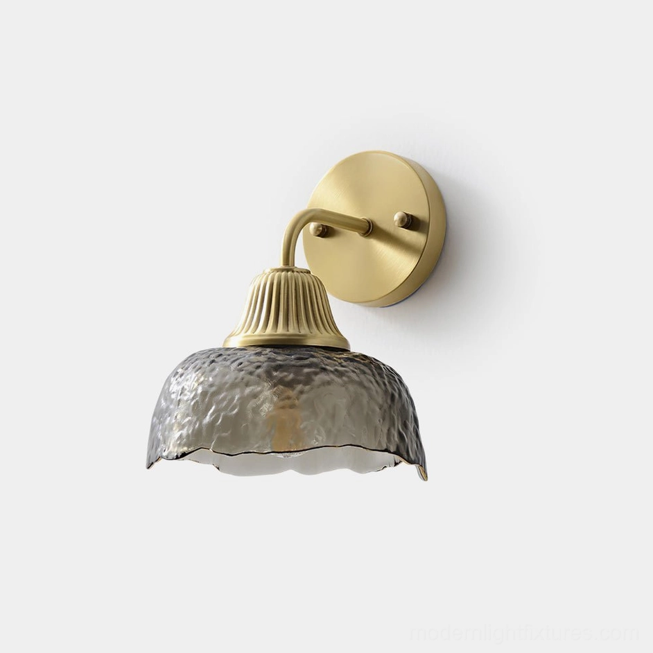 Lunara antique brass wall sconce with hand-hammered smoky grey glass shade, front studio view