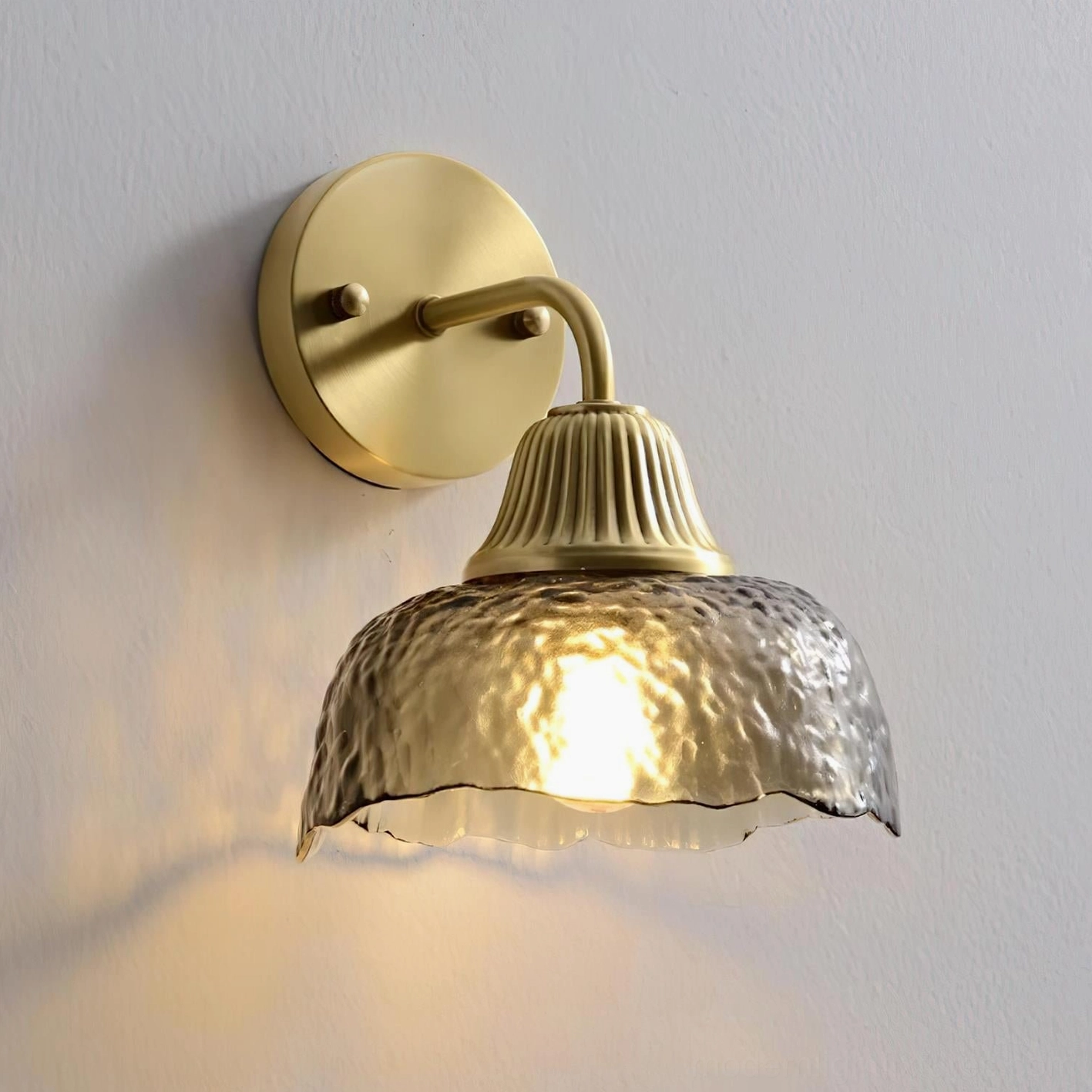 Lunara wall sconce clear glass shade antique brass modern contemporary lighting fixture detail