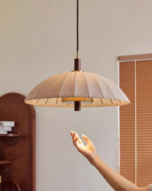 Modern Lunaro pendant light three-quarter view showing pleated fabric dome construction and inner lamp structure