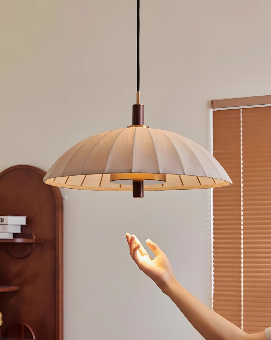 Modern Lunaro pendant light three-quarter view showing pleated fabric dome construction and inner lamp structure