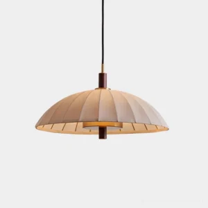 Lunaro pleated dome pendant light with beige fabric shade and brass metal accents, studio front view