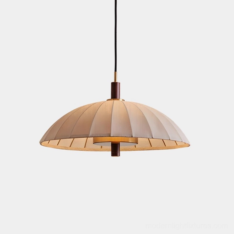 Lunaro pleated dome pendant light with beige fabric shade and brass metal accents, studio front view