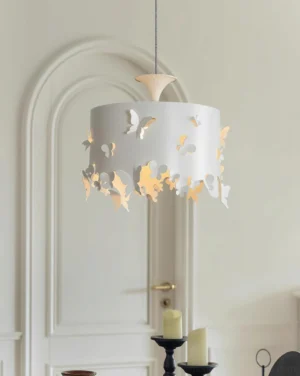 Butterfly pendant light suspended in modern entryway with arched white door, warm ambient lighting creating romantic shadows
